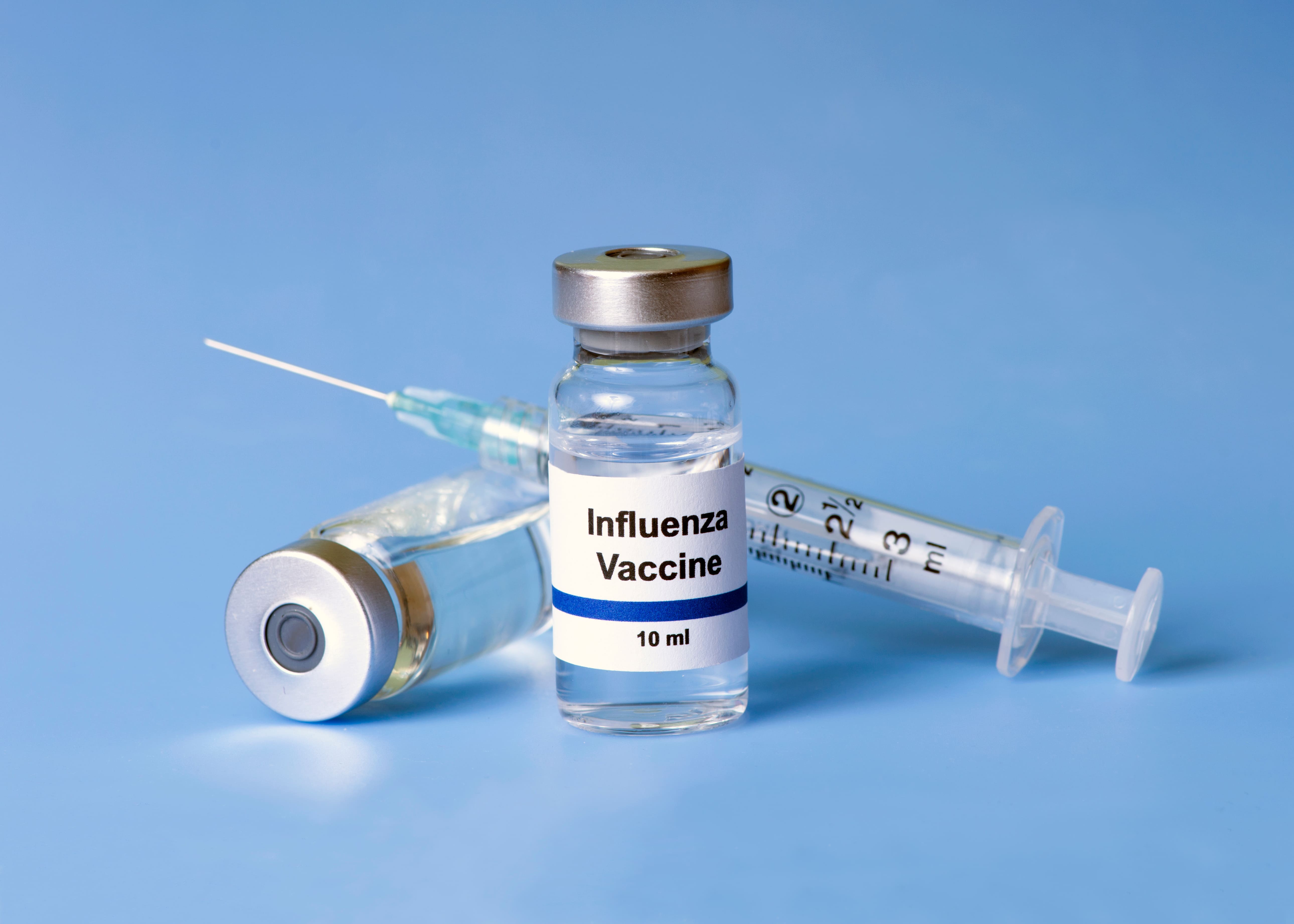 flu vaccine and syringe