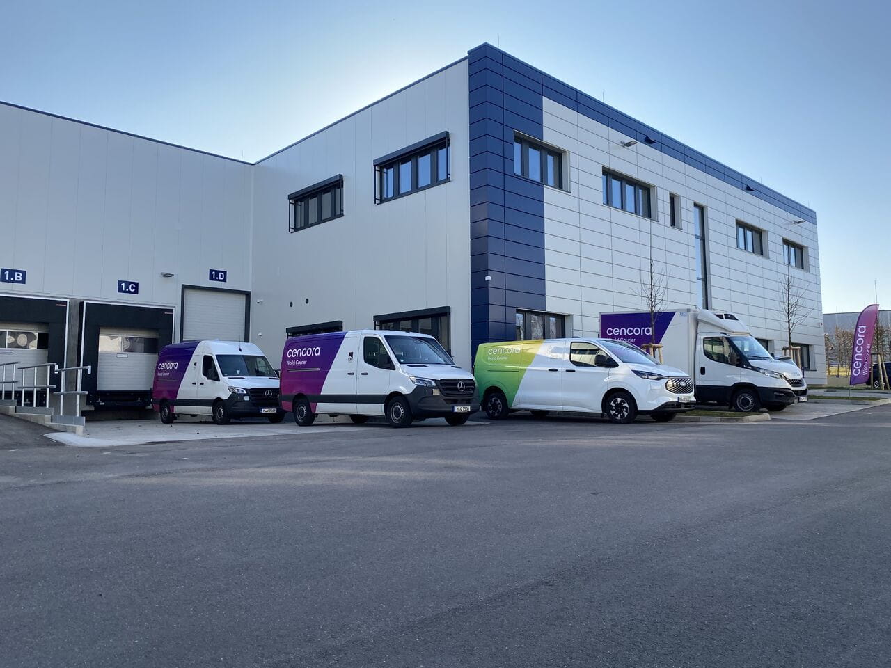 World Courier vans in front of new Stuttgart facility building