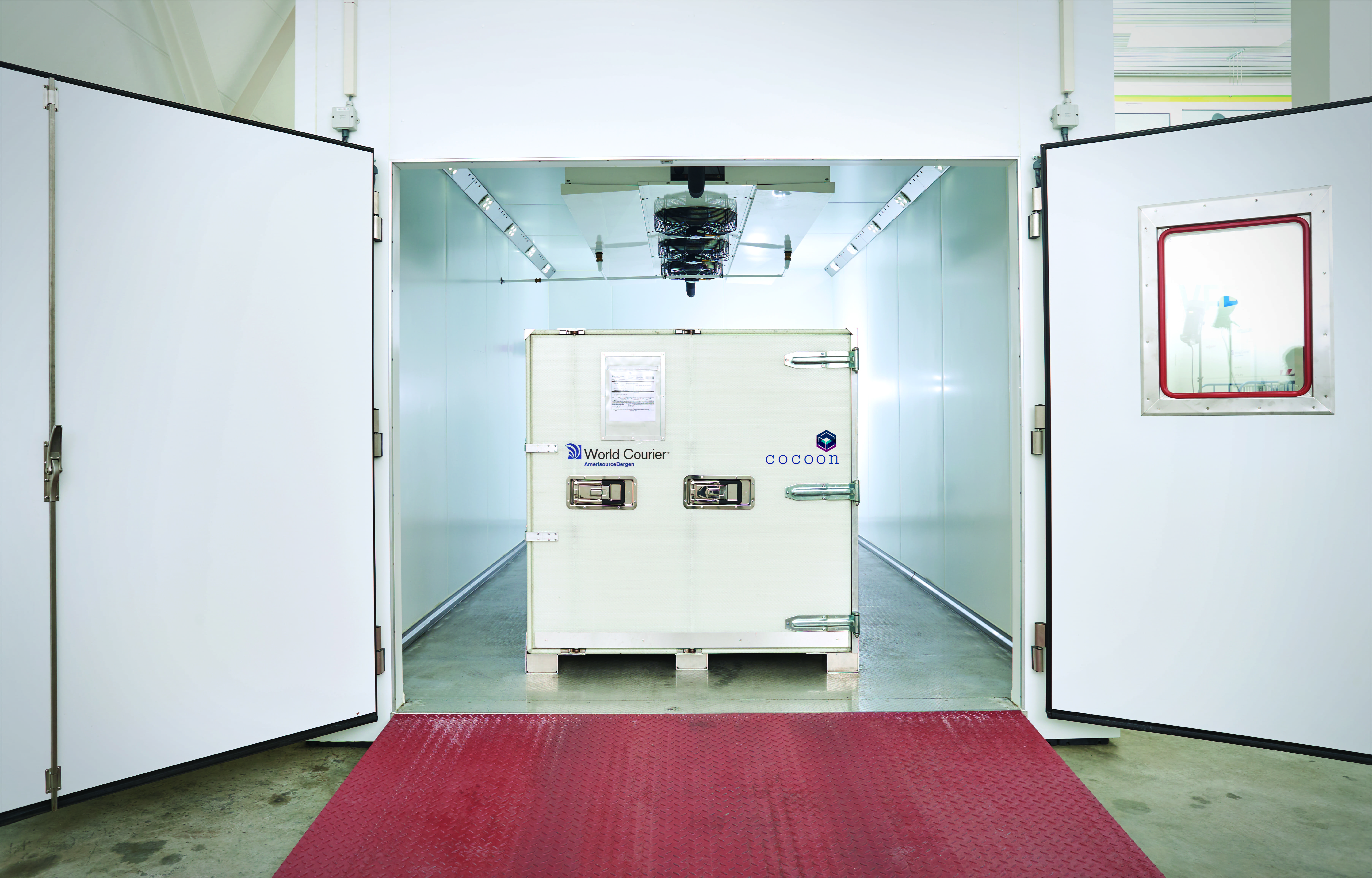 A cocoon shipping container sits inside a large climate chamber inside CORE Labs.